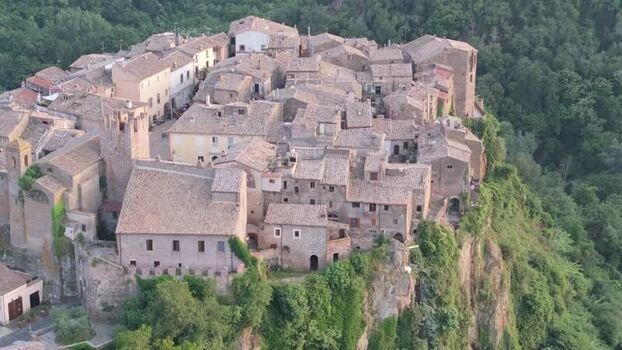 Aerial view of historic Calcata village on a cliff Italy. Aerial view of historic Calcata village on a cliff Italy.