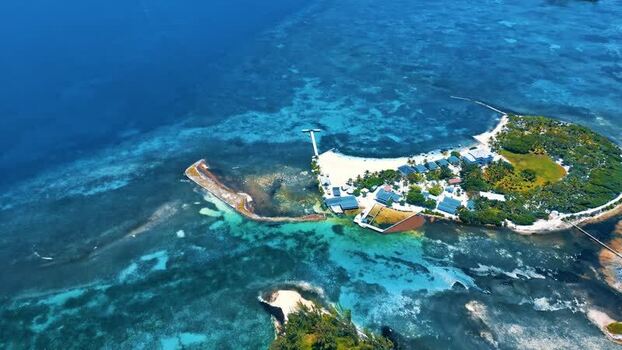 Aerial view of the tropical island of Guanaja and coral reefs Honduras.