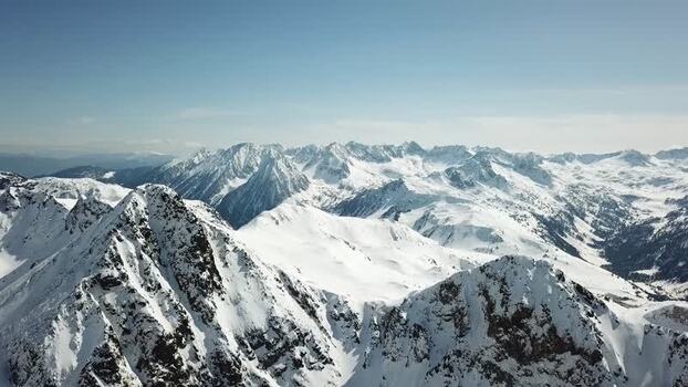 Aerial view of snowy Pyrenees peaks in Baqueira Spain.