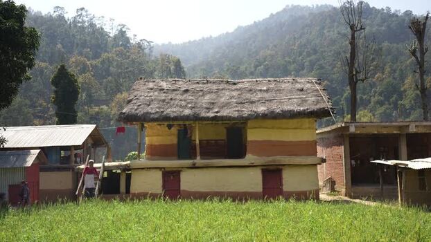 View of a traditional mud house in a rural landscape Nepal. View of a traditional mud house in a rural landscape Nepal.