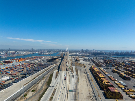 Aerial view of the Port of Long Beach featuring the Gerald Desmond Bridge shipping container terminals and highway infrastructure in Long Beach California United States. Aerial view of the Port of Long Beach featuring the Gerald Desmond Bridge shipping container terminals and highway infrastructure in Long Beach California United States.