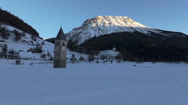 Aerial view of the sunken church tower in Graun im Vinschgau Italy. Aerial view of the sunken church tower in Graun im Vinschgau Italy.