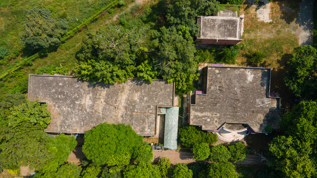 Lahore Pakistan 08 September 2026 Aerial view of the government office buildings surrounded by lush green trees and vegetation.