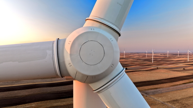 Aerial view of wind turbines in a field at sunset in Vladimirovac Vojvodina Serbia.