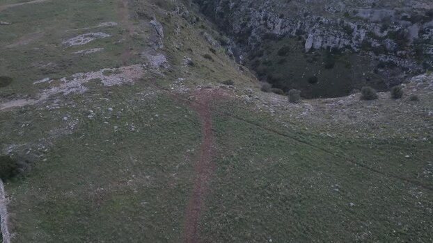 Aerial view of the rugged ravine landscape in Matera Italy.
