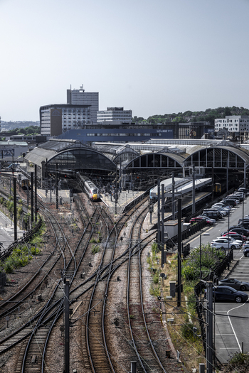 Aerial view of Newcastle Central Station with railway tracks platforms and urban buildings in Newcastle upon Tyne England United Kingdom. Aerial view of Newcastle Central Station with railway tracks platforms and urban buildings in Newcastle upon Tyne England United Kingdom.