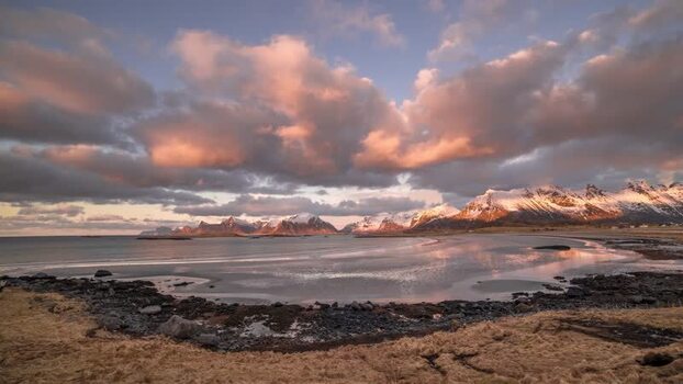 View of Lofoten mountains and bay at sunset in Norway. View of Lofoten mountains and bay at sunset in Norway.
