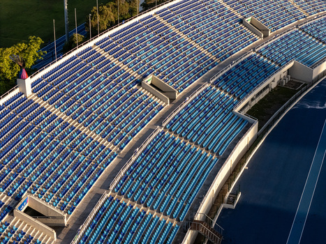 Aerial view of the blue stadium seating rows and athletic track in Santo Domingo Distrito Nacional Dominican Republic.