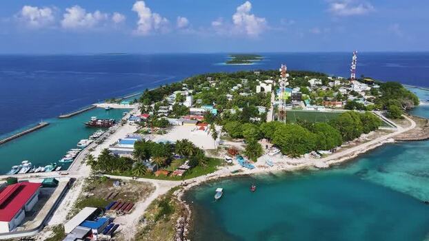 Aerial view of Kendhoo island with harbor and lush trees Maldives. Aerial view of Kendhoo island with harbor and lush trees Maldives.