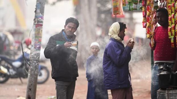 View of people drinking tea at a roadside stall in Bogura Bangladesh.