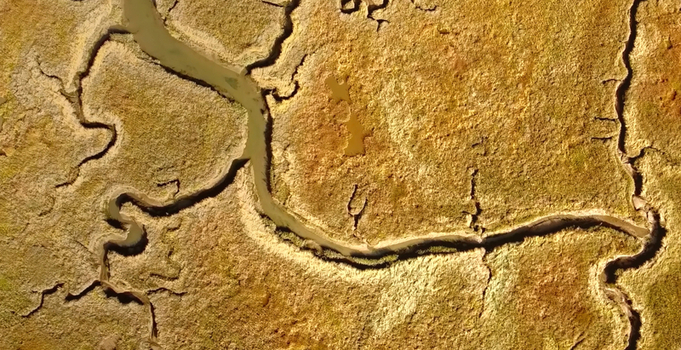 Aerial view of the winding tidal channels and salt marsh landscape of the Solway Firth in Castle Douglas Scotland United Kingdom. Aerial view of the winding tidal channels and salt marsh landscape of the Solway Firth in Castle Douglas Scotland United Kingdom.