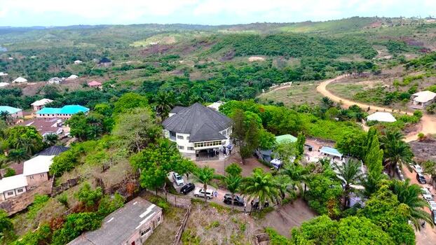 Aerial view of a settlement with a circular building Nigeria. Aerial view of a settlement with a circular building Nigeria.