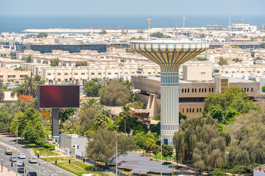 Aerial view of a distinctive mushroom shaped water tower surrounded by residential villas solar panels and lush greenery in Dubai Dubai United Arab Emirates. Aerial view of a distinctive mushroom shaped water tower surrounded by residential villas solar panels and lush greenery in Dubai Dubai United Arab Emirates.