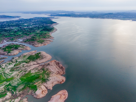 Aerial view of the stark contrast between the lush green landscapes and the calm expanse of the water Chakswari Azad Kashmir Pakistan. Aerial view of the stark contrast between the lush green landscapes and the calm expanse of the water Chakswari Azad Kashmir Pakistan.
