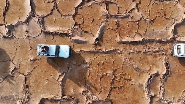 Aerial view of off road vehicles in the Danakil Desert Ethiopia. Aerial view of off road vehicles in the Danakil Desert Ethiopia.