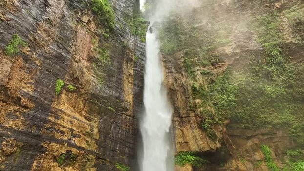 Aerial view of Kapas Biru Waterfall in Indonesia. Aerial view of Kapas Biru Waterfall in Indonesia.
