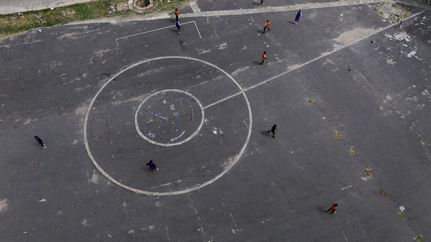 Aerial view of people playing on an asphalt sports court with circular markings at the National Stadium Surulere Lagos Lagos Lagos Nigeria.