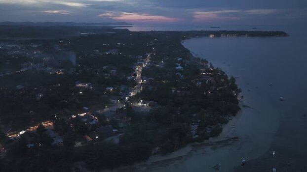 Aerial view of Siargao coastal town at night Philippines.