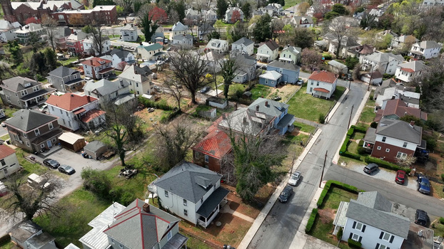 Aerial view of Rivermont Avenue in spring featuring historic residential houses lush green trees and quiet streets in Lynchburg Virginia United States.