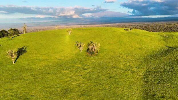 Aerial view of Puu Waawaa cinder cone and green hills United States. Aerial view of Puu Waawaa cinder cone and green hills United States.