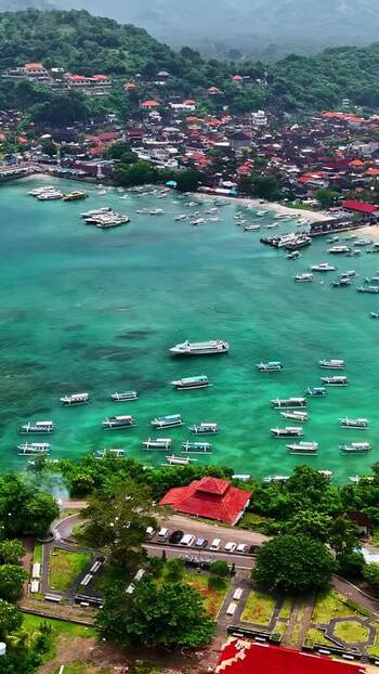 Aerial view of boats in the turquoise waters of Bali Indonesia.