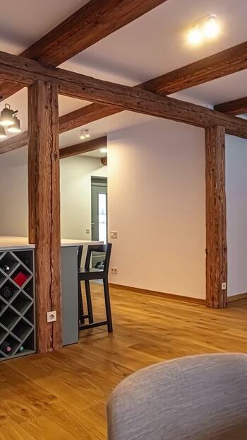 View of modern interior with exposed wooden beams in Latvia. View of modern interior with exposed wooden beams in Latvia.