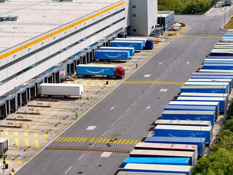 Torrazza Piemonte Italy 03 May 2026 Aerial view of the Amazon TRN1 fulfillment center with blue Prime trailers parked at loading docks and in rows under bright daylight. Torrazza Piemonte Italy 03 May 2026 Aerial view of the Amazon TRN1 fulfillment center with blue Prime trailers parked at loading docks and in rows under bright daylight.