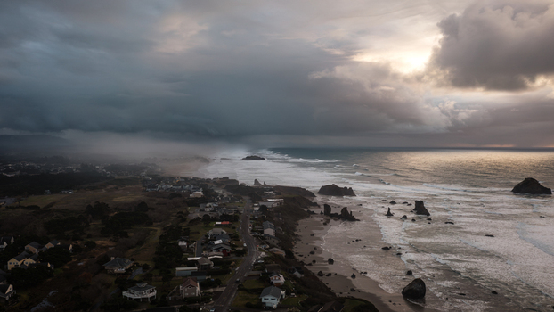 Aerial view of the dramatic winter storm over the rugged coastline and sea stacks of Bandon Oregon United States. Aerial view of the dramatic winter storm over the rugged coastline and sea stacks of Bandon Oregon United States.