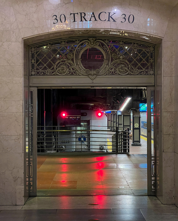 New York United States 14 May 2026 View of the ornate marble entrance to Track 30 at Grand Central Terminal with a train waiting at the platform under dim lighting. New York United States 14 May 2026 View of the ornate marble entrance to Track 30 at Grand Central Terminal with a train waiting at the platform under dim lighting.