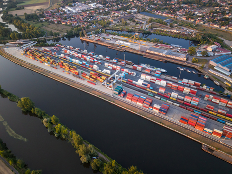 Melnik Czechia 03 August 2026 Aerial view of Terminal Ceske Pristavy featuring rows of colorful shipping containers stacked along the river port surrounded by industrial infrastructure. Melnik Czechia 03 August 2026 Aerial view of Terminal Ceske Pristavy featuring rows of colorful shipping containers stacked along the river port surrounded by industrial infrastructure.