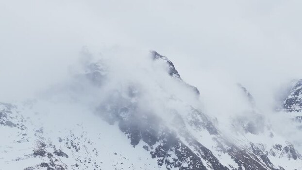 Aerial view of snow capped mountain peaks Norway.
