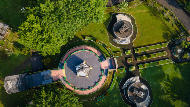 Purwokerto Indonesia 08 May 2026 Aerial view of the National Monument of Jendral Soedirman featuring circular stone platforms lush green lawns and surrounding trees. Purwokerto Indonesia 08 May 2026 Aerial view of the National Monument of Jendral Soedirman featuring circular stone platforms lush green lawns and surrounding trees.
