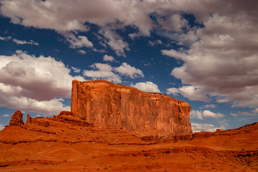 Oljato Monument Valley Arizona United States 05 September 2018 View of the iconic red sandstone buttes of Monument Valley under a dramatic blue sky with scattered white clouds. Oljato Monument Valley Arizona United States 05 September 2018 View of the iconic red sandstone buttes of Monument Valley under a dramatic blue sky with scattered white clouds.