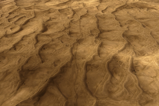 Aerial view of the vast desert landscape with intricate sand dunes and natural textures in Senek Mangystau Region Kazakhstan.