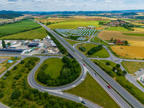 Aerial view of the highway interchange near Zebrak with solar panels green fields and rural landscape in Zebrak Central Bohemian Region Czechia. Aerial view of the highway interchange near Zebrak with solar panels green fields and rural landscape in Zebrak Central Bohemian Region Czechia.