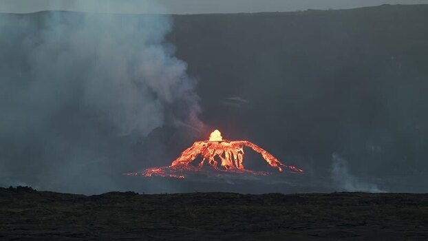 View of a lava cone erupting with smoke United States.