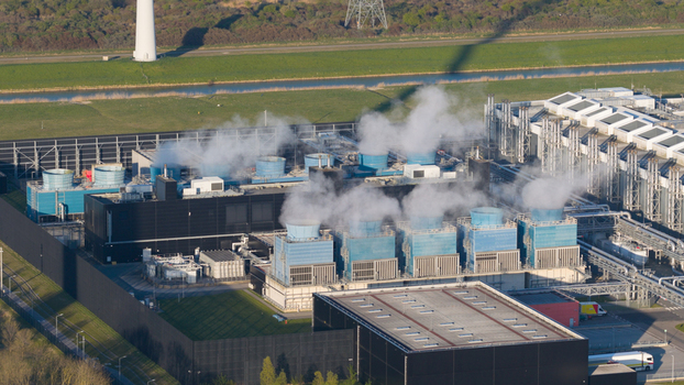 Drone view of a hyperscale data center in Eemshaven showing cloud computing server infrastructure cooling systems backup power and digital connectivity. Drone view of a hyperscale data center in Eemshaven showing cloud computing server infrastructure cooling systems backup power and digital connectivity.