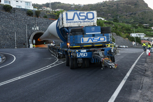Estreito da Calheta Portugal 20 September 2026 View of a large LASO transport truck carrying a wind turbine blade into a tunnel entrance in the mountainous landscape of Madeira. Estreito da Calheta Portugal 20 September 2026 View of a large LASO transport truck carrying a wind turbine blade into a tunnel entrance in the mountainous landscape of Madeira.