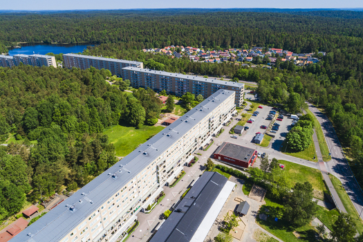 Aerial view of Rannebergen residential area featuring long apartment blocks surrounded by dense forest green spaces and a parking lot in Gothenburg Vastra Gotaland Count Sweden. Aerial view of Rannebergen residential area featuring long apartment blocks surrounded by dense forest green spaces and a parking lot in Gothenburg Vastra Gotaland Count Sweden.