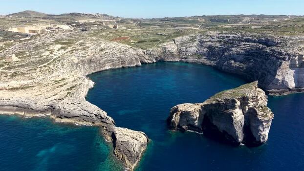 Aerial view of Dwejra Bay and rocky cliffs in Gozo region Malta. Aerial view of Dwejra Bay and rocky cliffs in Gozo region Malta.