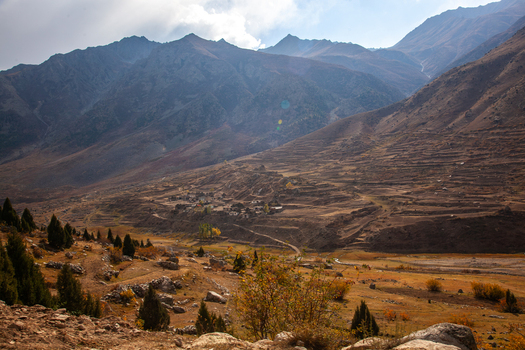 View of the Astore Valley featuring terraced fields a small village nestled among rugged mountains and autumn foliage in Astore Gilgit Pakistan. View of the Astore Valley featuring terraced fields a small village nestled among rugged mountains and autumn foliage in Astore Gilgit Pakistan.