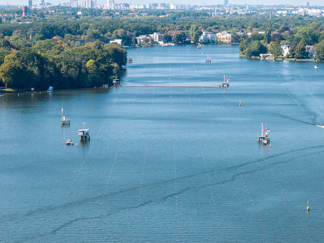 Aerial view of the Berlin Grunau Regatta Course on the Dahme river with race lanes buoys and surrounding trees under a clear sky Berlin Berlin Germany. Aerial view of the Berlin Grunau Regatta Course on the Dahme river with race lanes buoys and surrounding trees under a clear sky Berlin Berlin Germany.
