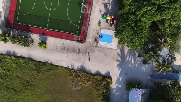 Aerial view of a football pitch and playground Maldives. Aerial view of a football pitch and playground Maldives.