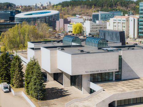 Aerial view of the modern MO Museum building with its white facade glass skylights and surrounding urban landscape in Vilnius Vilniaus apskritis Lithuania. Aerial view of the modern MO Museum building with its white facade glass skylights and surrounding urban landscape in Vilnius Vilniaus apskritis Lithuania.