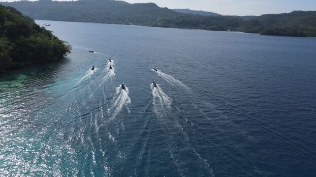 Aerial view of boats in Raja Ampat Indonesia. Aerial view of boats in Raja Ampat Indonesia.