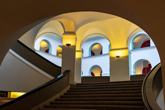 View of the elegant arched architecture and grand staircase inside the Swiss National Museum in Zurich Zurich Switzerland.