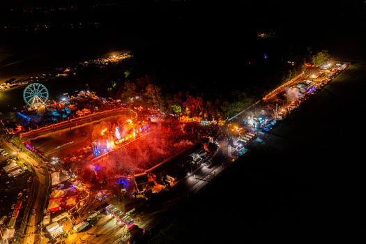 Herzogenaurach Germany 27 July 2025 Aerial view of the Open Beatz Festival featuring illuminated stages a Ferris wheel and a large crowd of people gathered at night. Herzogenaurach Germany 27 July 2025 Aerial view of the Open Beatz Festival featuring illuminated stages a Ferris wheel and a large crowd of people gathered at night.