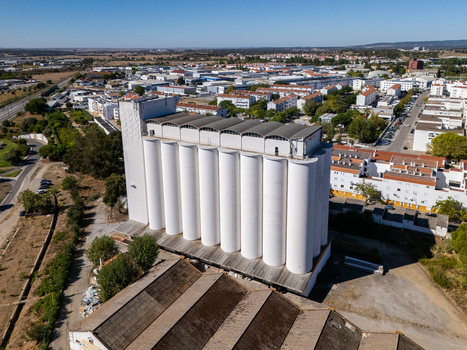 Aerial view of the large white grain silo in the industrial area of Evora Evora District Portugal. Aerial view of the large white grain silo in the industrial area of Evora Evora District Portugal.