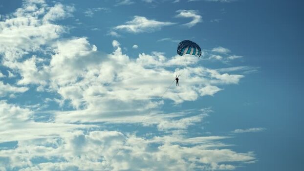 View of a person parasailing against a cloudy sky Bangladesh.