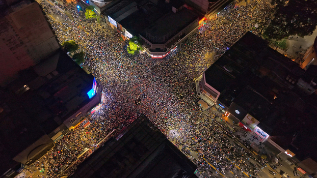 Buenos Aires Argentina 15 July 2026 Aerial view of a massive crowd celebrating at the Cabildo and Juramento intersection in Belgrano at night with illuminated city streets. Buenos Aires Argentina 15 July 2026 Aerial view of a massive crowd celebrating at the Cabildo and Juramento intersection in Belgrano at night with illuminated city streets.